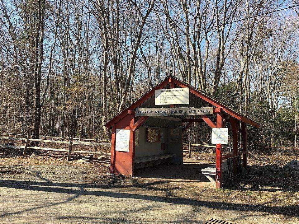 Larsen Sanctuary nature center entrance with red covered bridge structure in Fairfield, CT