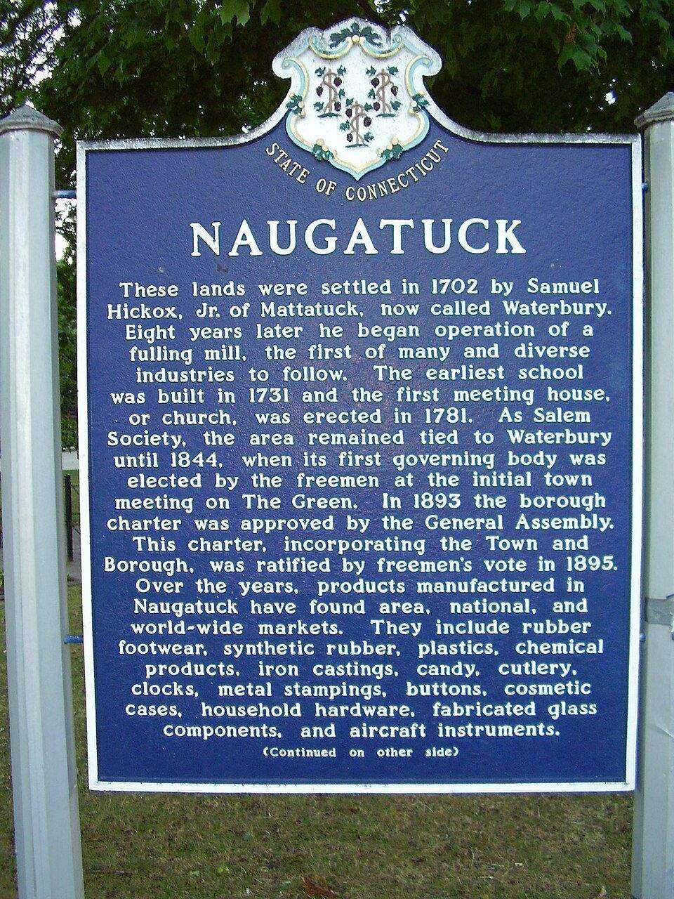 Naugatuck historic town marker with Connecticut state seal detailing the borough's history