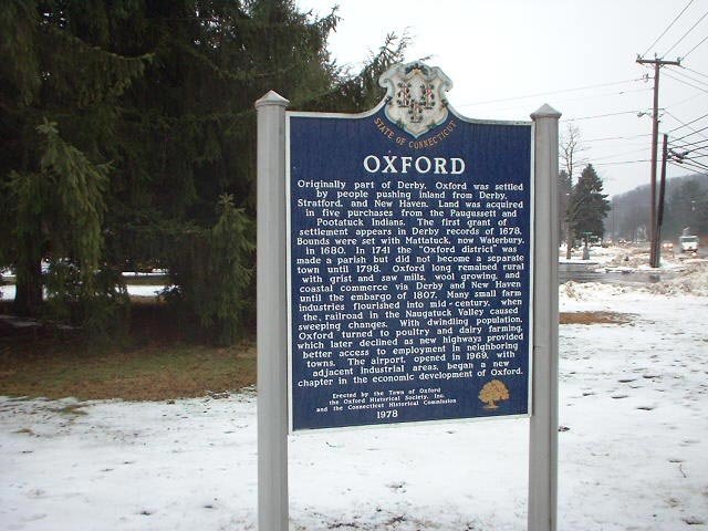 Oxford Connecticut historic town marker with state seal in winter snow