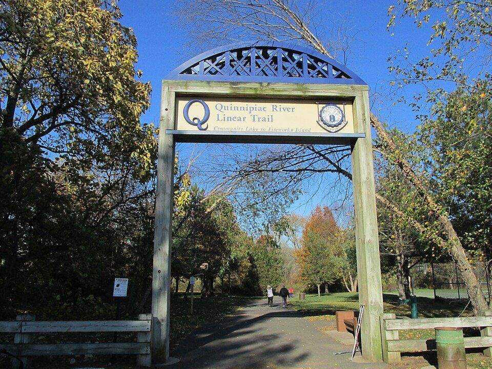 Quinnipiac River Linear Trail entrance sign and archway in Wallingford, CT