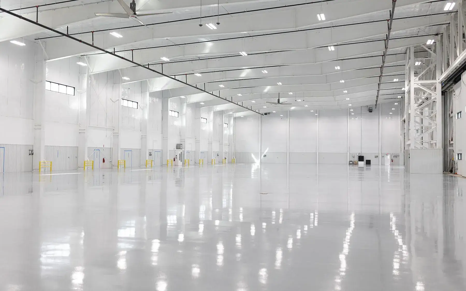 Clay Lacy Aviation completed hangar interior with high bay lighting
