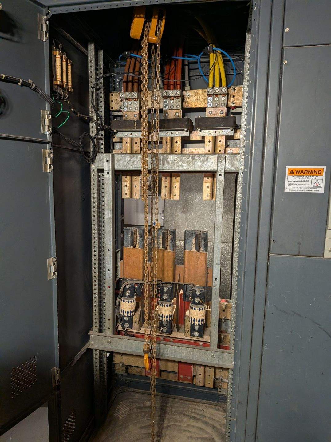 Empty switchgear cabinet with bus bars exposed